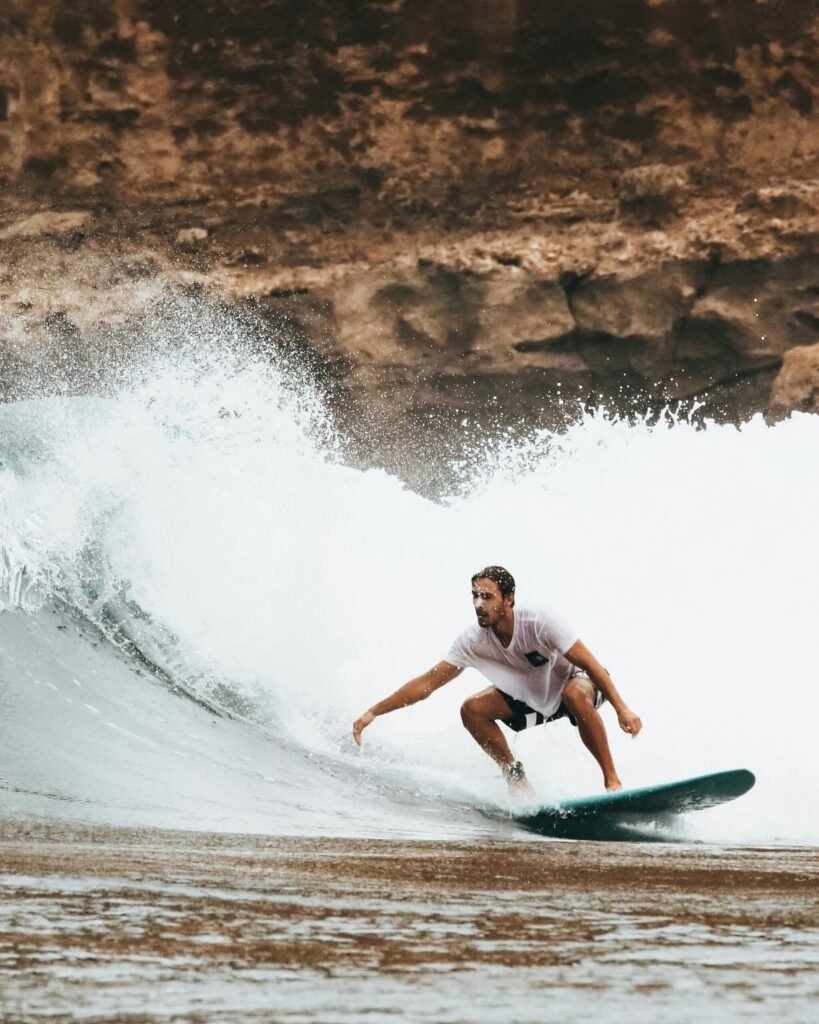 Man Surfing On Ocean Waves